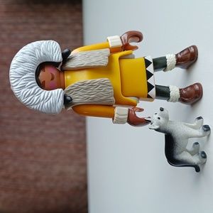 Inuit Eskimo girl with a husky